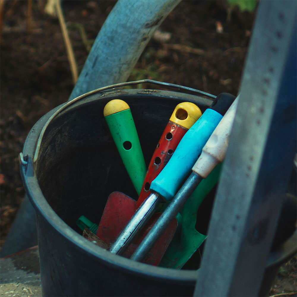 Bucket full of gardening tools